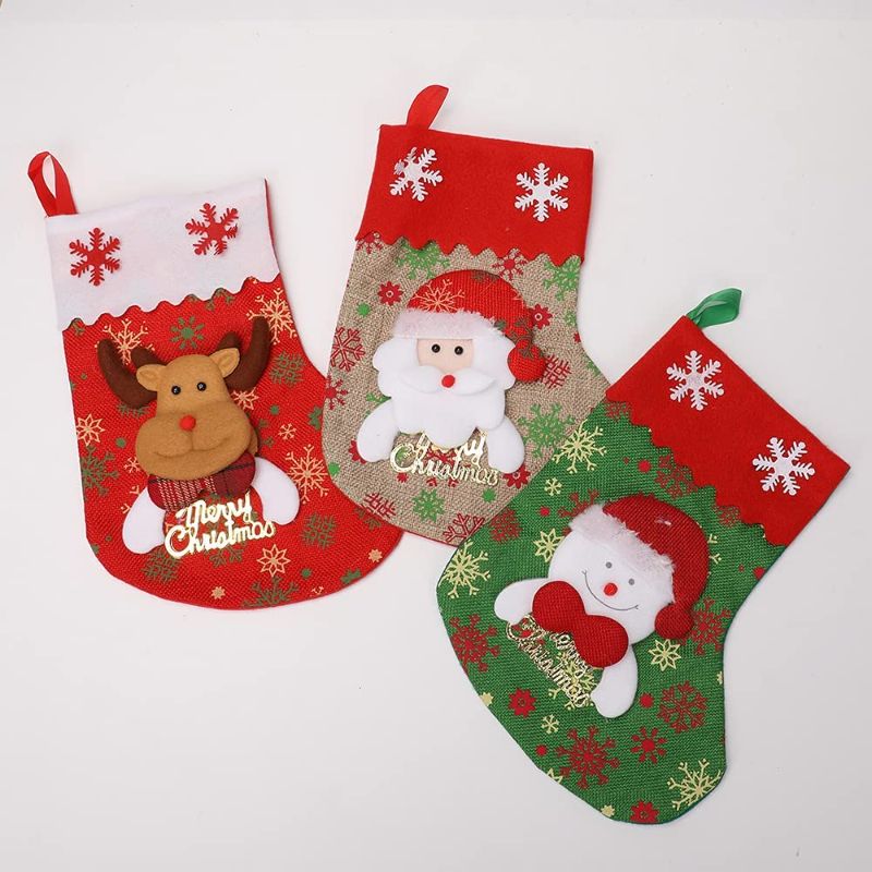 Photo 1 of Balagan Christmas Stockings 3 Pack 11 Inch Santa Snowman Reindear Burlap Farmhouse Christmas Stockings for Kids Family Party Holiday Decor
