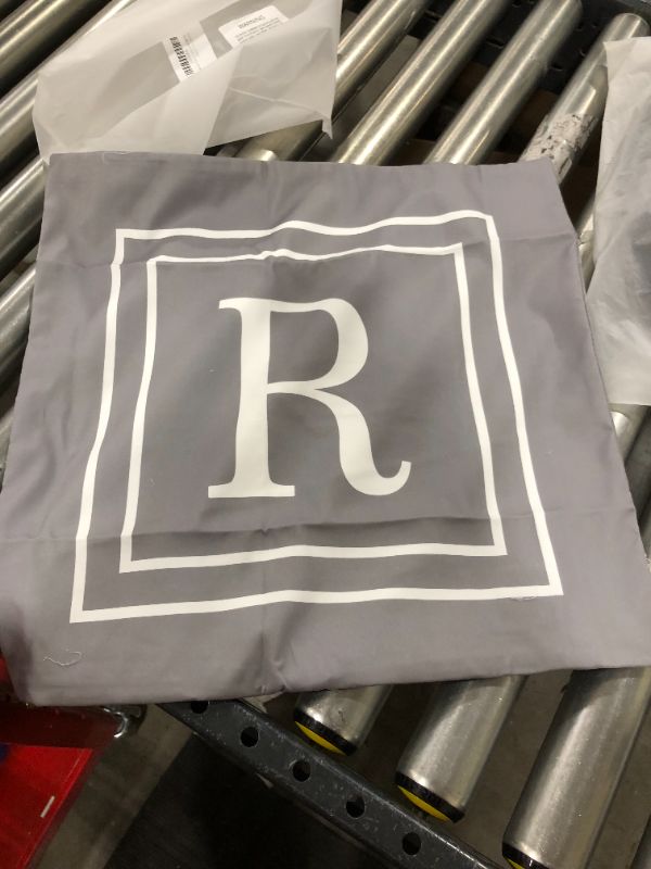 Photo 1 of 17" x 17" grey pillow case with letter R