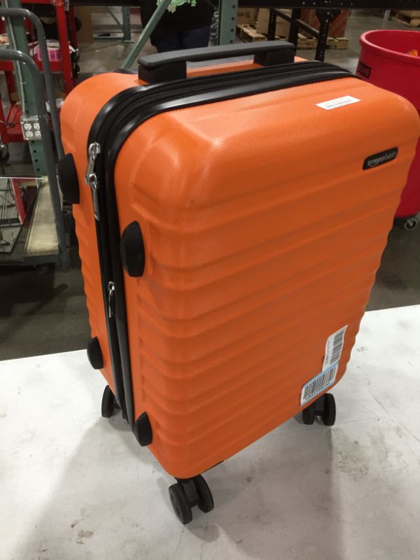 Photo 2 of Amazon Basics Hardside Spinner Suitcase Carry-On Luggage with Wheels - 20-Inch, Orange
