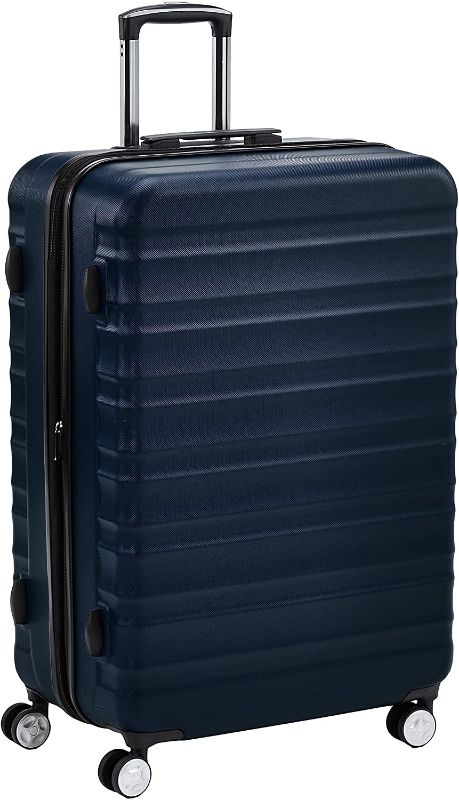 Photo 1 of Amazon Basics Hardside Spinner Suitcase Luggage with Wheels - 28-Inch, Navy Blue
