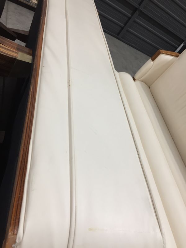 Photo 1 of CREME COLORED FAUX LEATHER L SHAPE SECTIONAL COUCH 100L X 26W X 38H INCHES (2 PIECES)