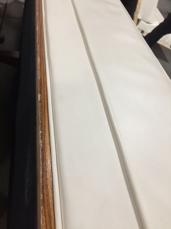 Photo 1 of CREME COLORED FAUX LEATHER L SHAPE SECTIONAL COUCH 100L X 26W X 38H INCHES (2 PIECES)