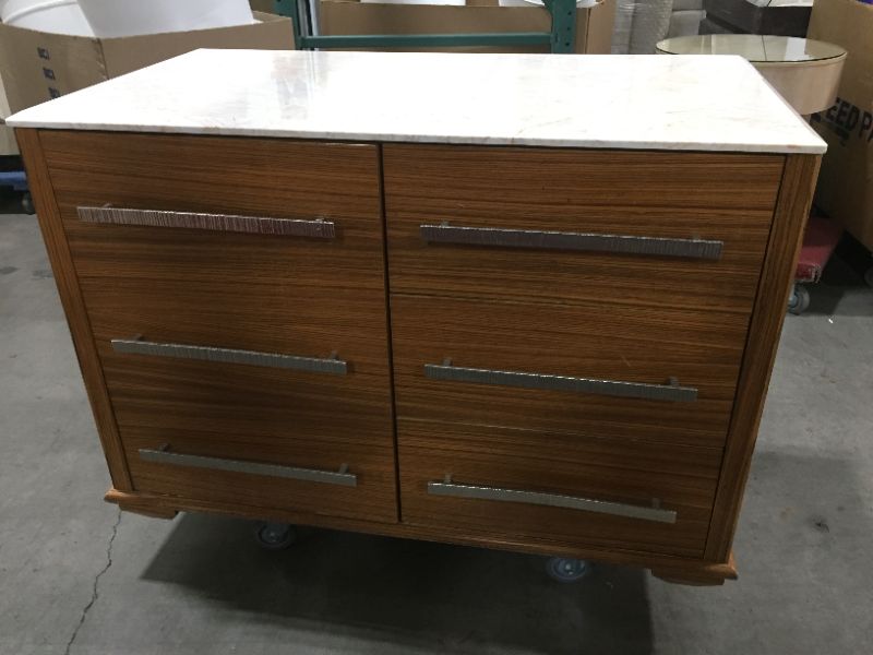 Photo 1 of 4 DRAWER WOODEN DRESSER H36 INCH W48 INCH L26 INCH DRESSER ONLY CHIPS ON INSIDE OF DRESSER