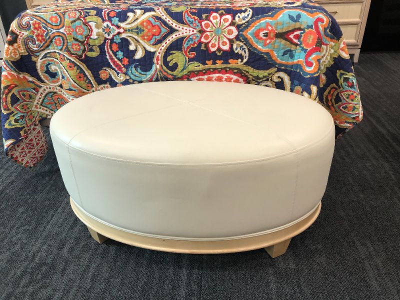 Photo 1 of CREME FAUX LEATHER OTTOMAN 38L X 25W