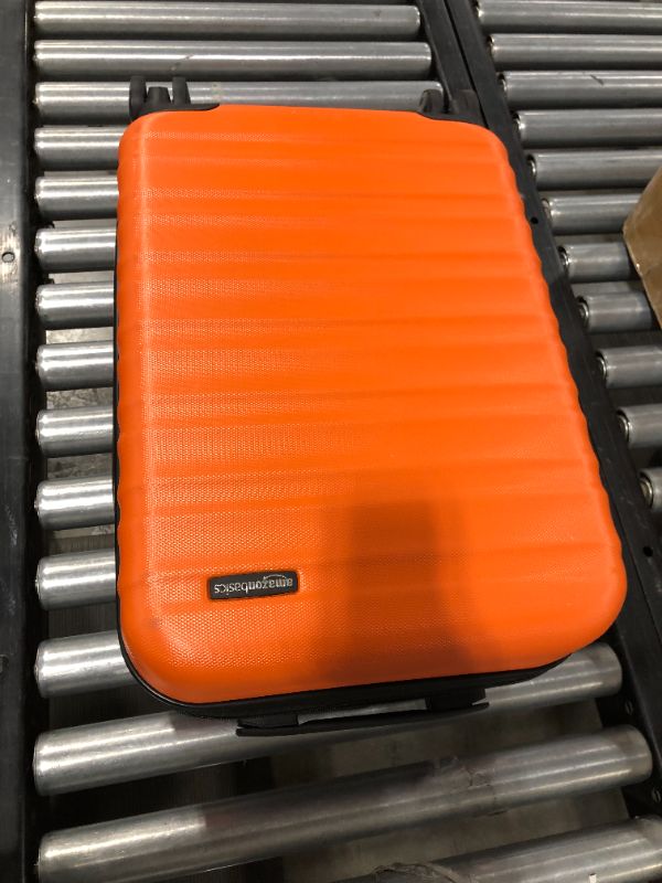 Photo 2 of 21-Inch Hardside Spinner, Orange