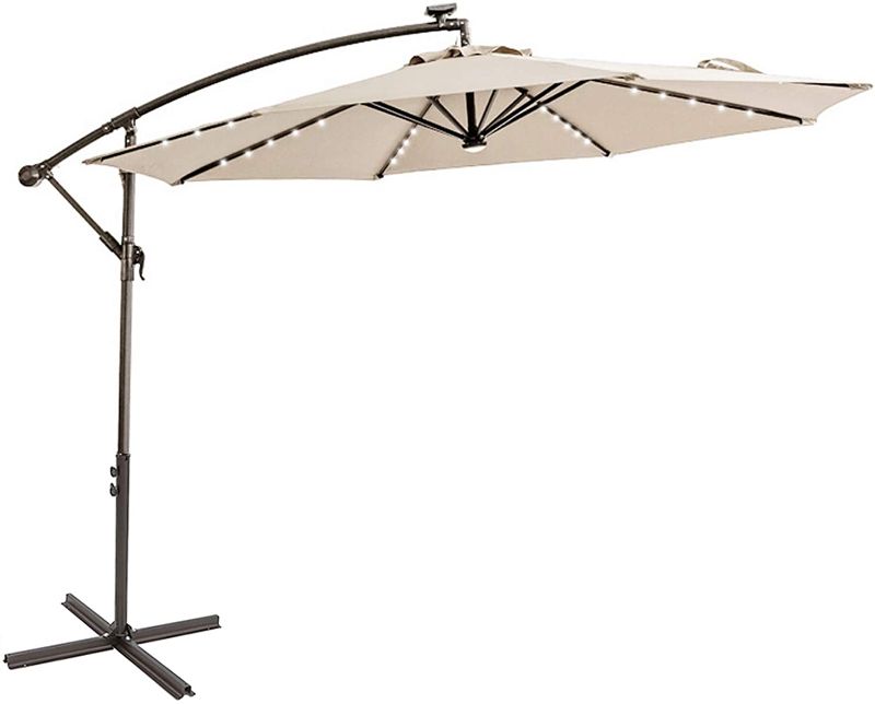 Photo 1 of C-Hopetree 10 ft Offset Cantilever Outdoor Patio Umbrella with Solar LED Lights and Cross Base Stand, Beige

