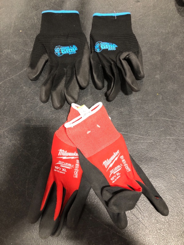 Photo 2 of MILWAUKEE CUT LEVEL 1 10" GLOVE, RED/BLACK, SIZE XL. & GORILLA GRIP TRAX GLOVE, BLUE/BLACK, SIZE LARGE. LOT OF 2 PAIR. 