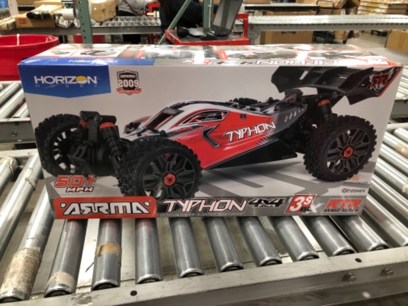 Photo 3 of ARRMA 1/8 Typhon 4X4 V3 3S BLX Brushless Buggy RC Truck RTR (Transmitter and Receiver Included, Batteries and Charger Required), Red, ARA4306V3. PRIOR USE. MISSING CHARGER AND BATTERIES. 
