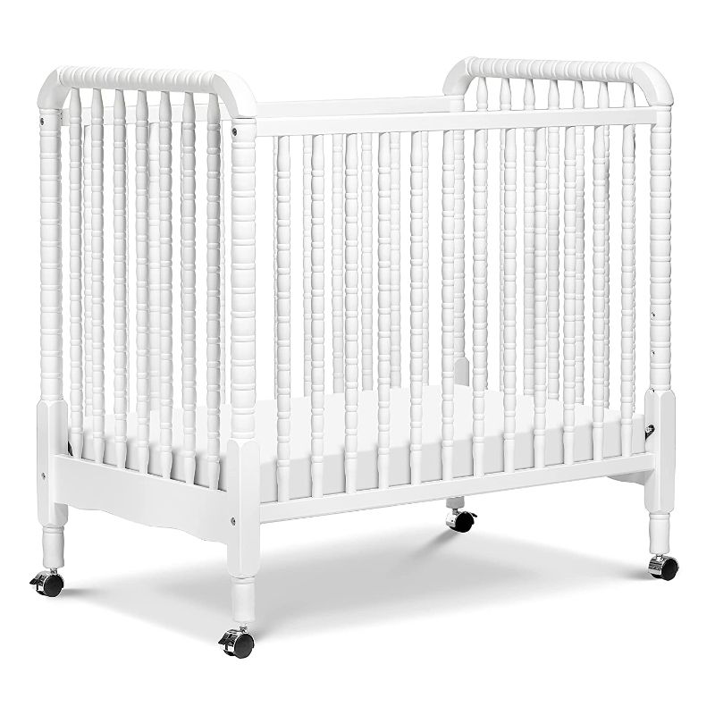 Photo 1 of DaVinci Jenny Lind 3-in-1 Convertible Mini Crib in White, Removable Wheels, Greenguard Gold Certified
