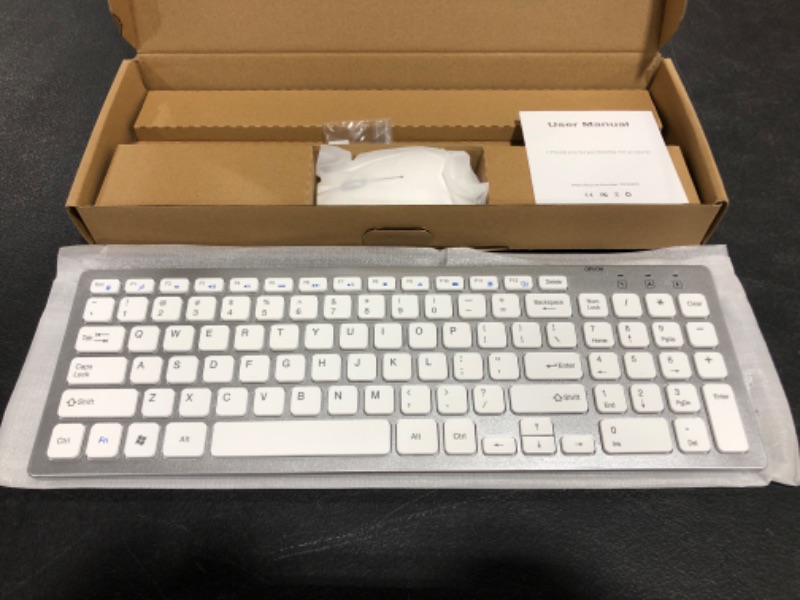 Photo 2 of Wireless Keyboard and Mouse Combo - Full Size Slim Thin Wireless Keyboard Mouse with Numeric Keypad with On/Off Switch on Both Keyboard and Mouse - White & Silver
MAY VARY SLIGHTLY.