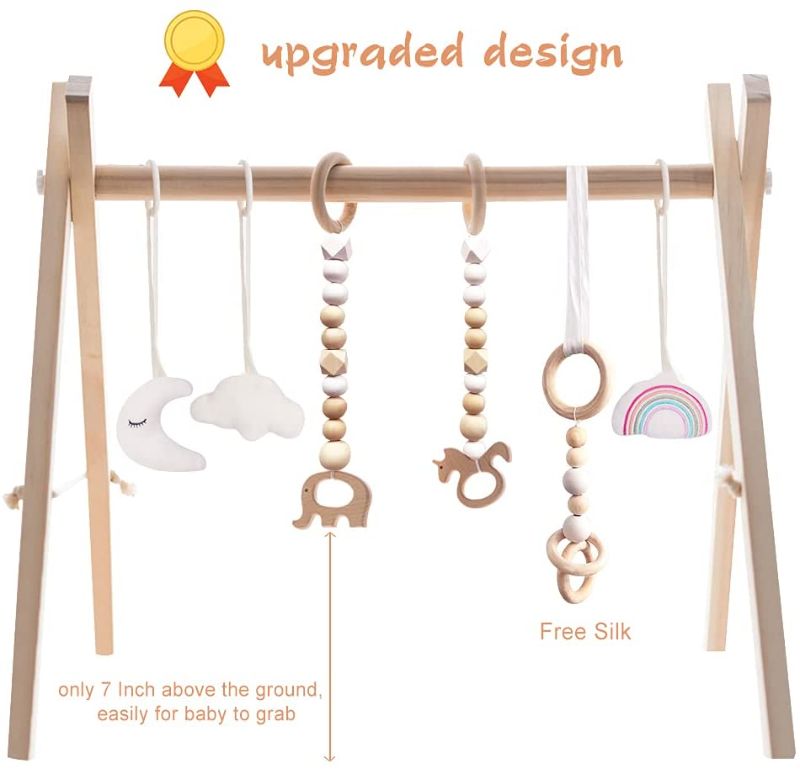 Photo 1 of little dove Baby Play Gym Wooden Baby Gym with 6 Toys Foldable Play Gym Frame Activity Gym Hanging Bar Baby Toy White
