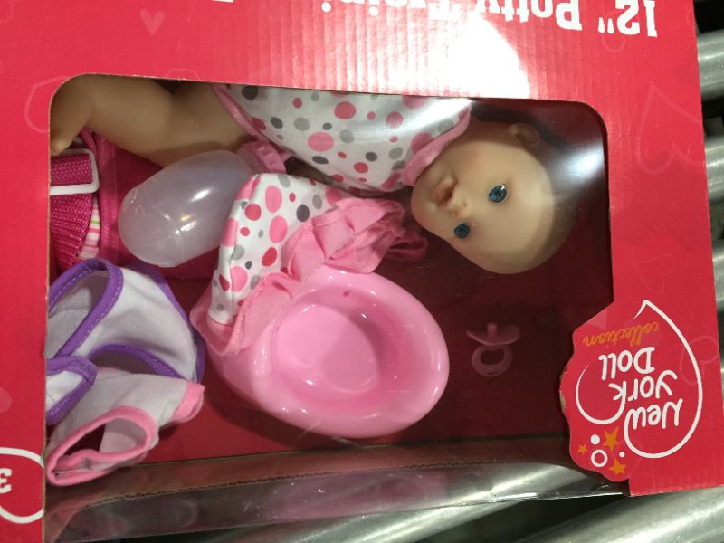 Photo 2 of Drink and Wet Potty Training Baby Doll posable Dolls with Pacifier, Bottle, and Diapers - Helps Toilet Training for Kids 
