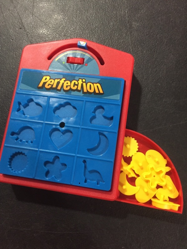 Photo 2 of Hasbro Gaming Perfection Popping Shapes and Pieces Game for Kids Ages 4 and Up
