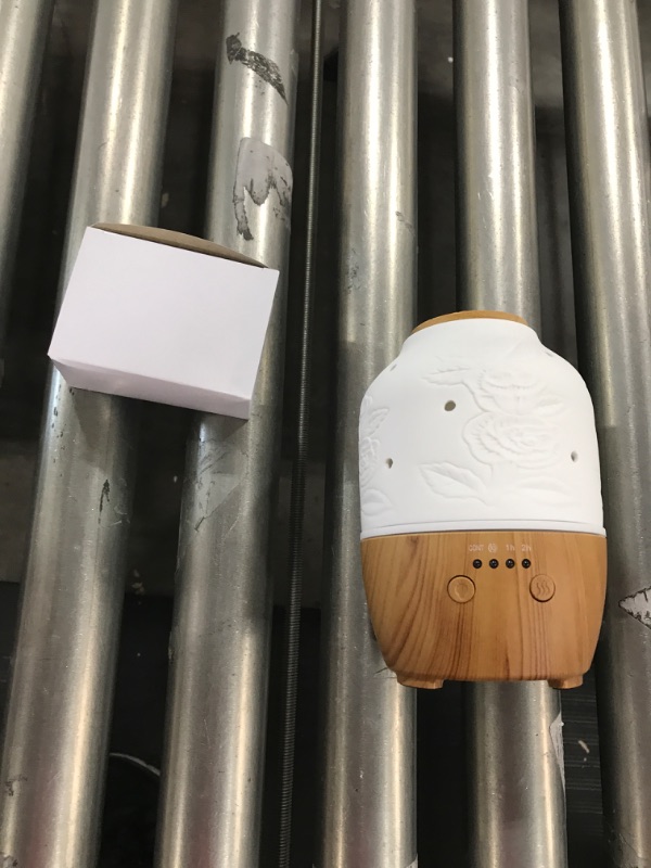 Photo 1 of Essential Oil Diffuser, White Ceramic Diffusers for Essential Oils, Oil Diffuser with 7 LED Color Changing Light and Auto-Off Safety Switch (New Pattern-04)
