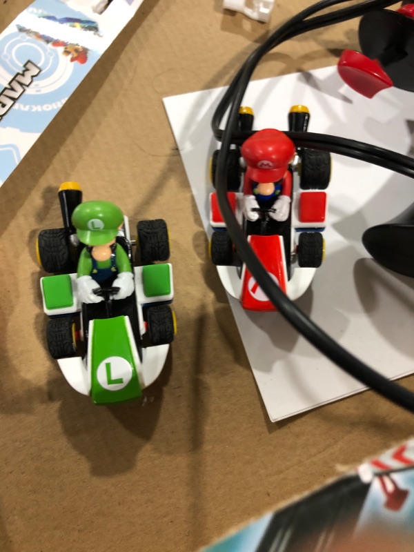 Photo 5 of Carrera GO!!! 62491 Mario Kart Electric Powered Slot Car Racing Kids Toy Race Track Set Includes 2 Hand Controllers Featuring Mario Versus Luigi in 1:43 Scale
