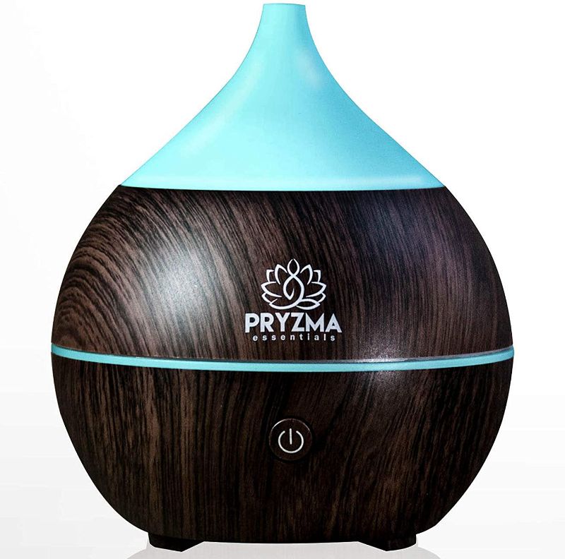 Photo 1 of Pryzma Essentials All in One Bluetooth Speaker Aromatherapy Smart Essential Oil Diffuser, 7 LED Therapy Night Light, 200ml Cool Mist Ultrasonic Humidifier, Wood Grain and Waterless Auto Shut-off

