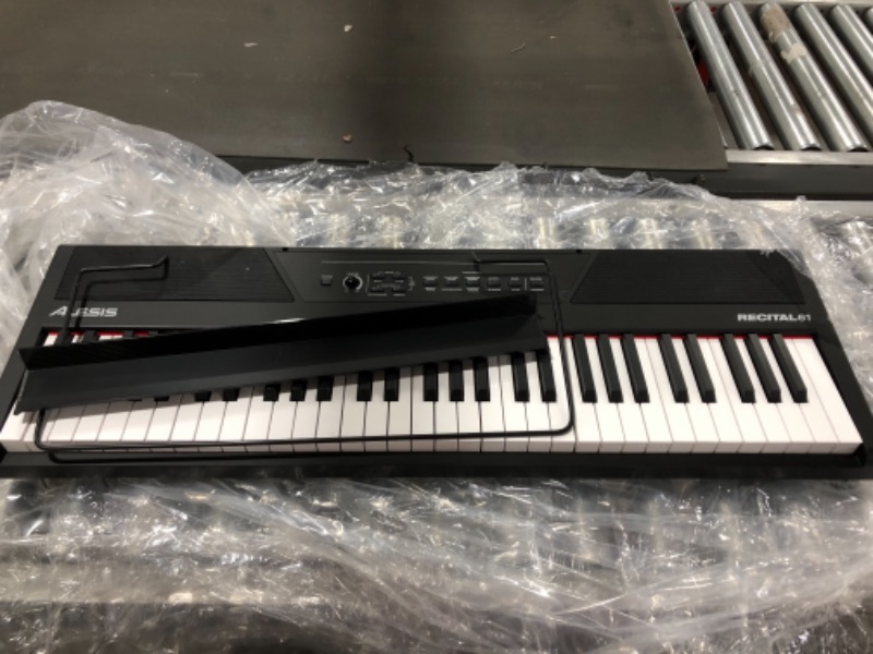 Photo 4 of Alesis Recital 61 – 61 Key Digital Piano Keyboard with Semi Weighted Keys, 20W Speakers, 10 Voices, Split, Layer and Lesson Mode, FX and Piano Lessons. MISSING POWER CORD. 
