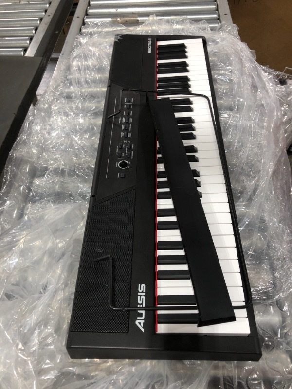 Photo 1 of Alesis Recital 61 – 61 Key Digital Piano Keyboard with Semi Weighted Keys, 20W Speakers, 10 Voices, Split, Layer and Lesson Mode, FX and Piano Lessons. MISSING POWER CORD. 
