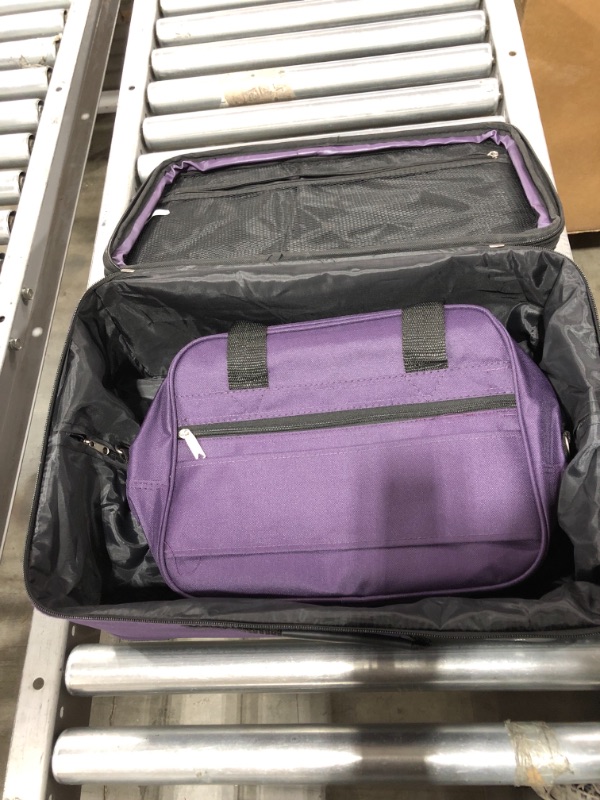 Photo 2 of ROCKLAND 14 INCH CARRY-ON SUITCASE. PURPLE.