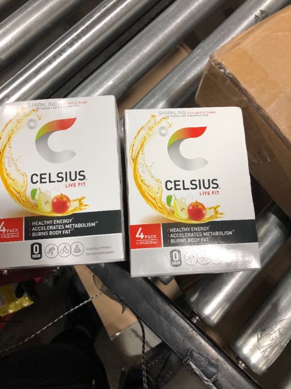 Photo 1 of CELSIUS Essential Energy Drink 12 Fl Oz, Sparkling Fuji Apple Pear (pack of 4) ( 2 packs) exp. 08/2021