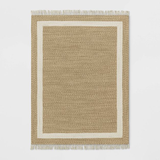 Photo 1 of Braided Outdoor Rug with Fringe Neutral/Ivory - Threshold™ designed with Studio McGee (size 5' x 7')

