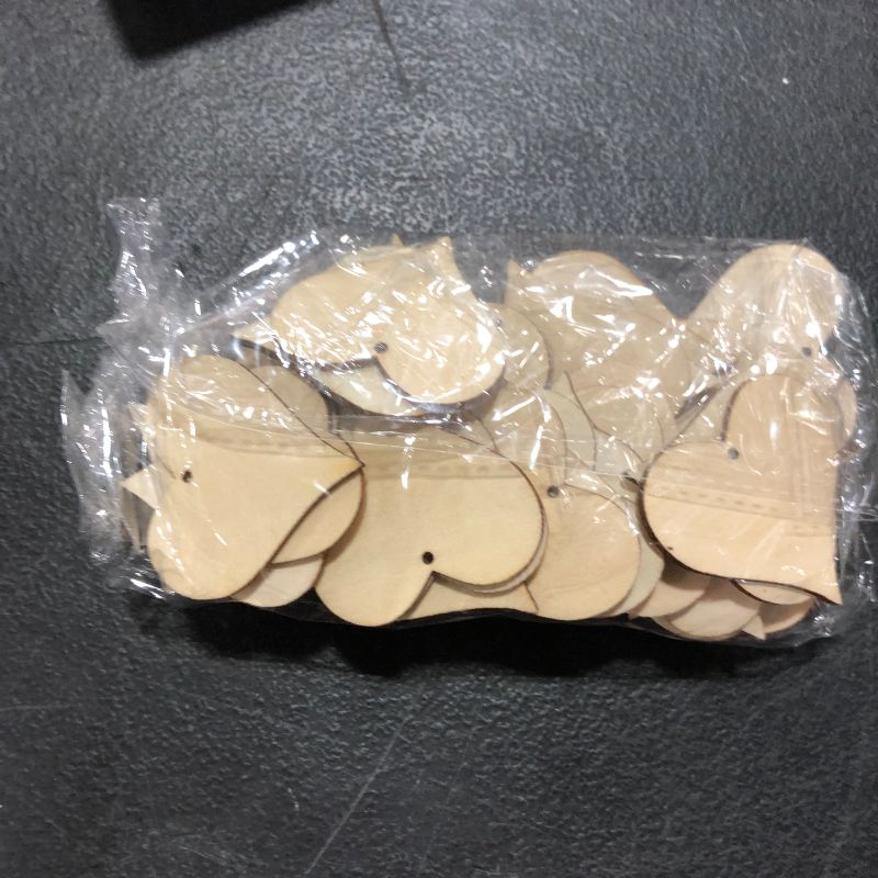 Photo 2 of Bastex Wood Heart Shape 2 inch Slices 100 Pieces. Blank Wooden Tags with Holes. Great for DIY Wedding Décor, Wood Burning, Making Ornaments. 47mm Heart Shaped Craft Wood Name Tags.
