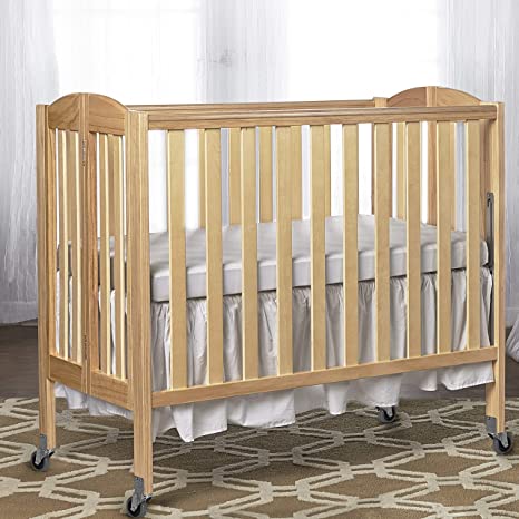 Photo 1 of Dream On Me 2-in-1 Folding Portable Crib, Natural, Large
