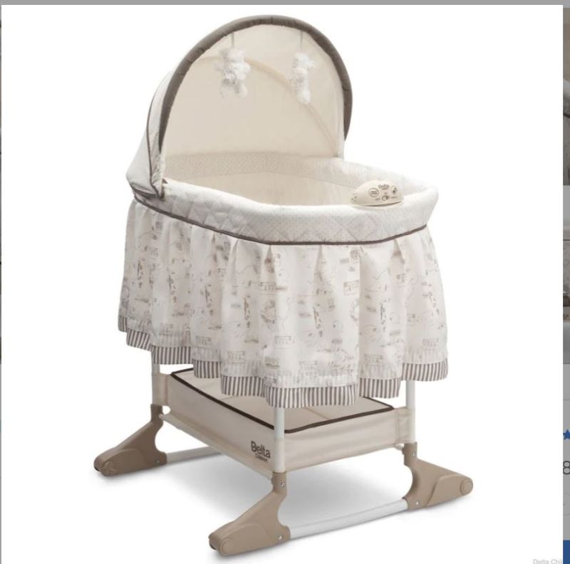 Photo 1 of DELTA CHILDREN PLAYTIME JUNGLE ROCKING BASSINET