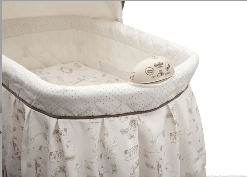 Photo 1 of DELTA CHILDREN PLAYTIME JUNGLE ROCKING BASSINET