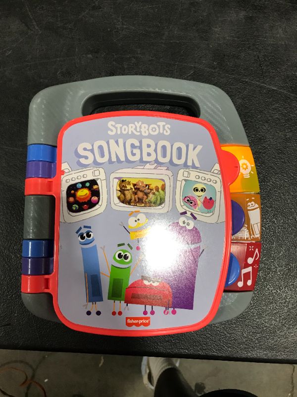 Photo 2 of Fisher-Price StoryBots Songbook, musical book with facts about space, dinosaurs and the human body for preschool kids ages 3 years and up