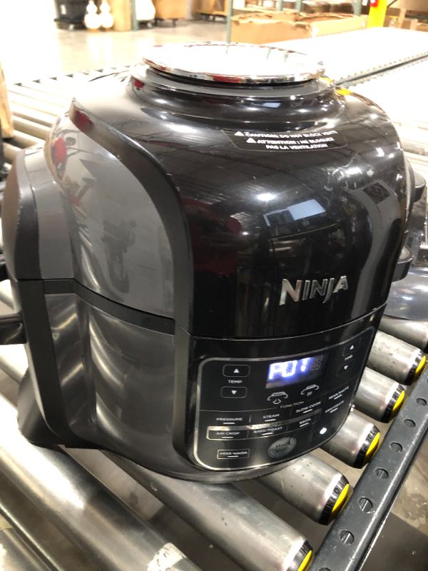 Photo 2 of Ninja OL601 Foodi XL 8 Qt. Pressure Cooker Steam Fryer with SmartLid, 14-in-1 that Air Fries, Bakes & More, with 3-Layer Capacity, 5 Qt. Crisp Basket & 45 Recipes, Silver/Black
