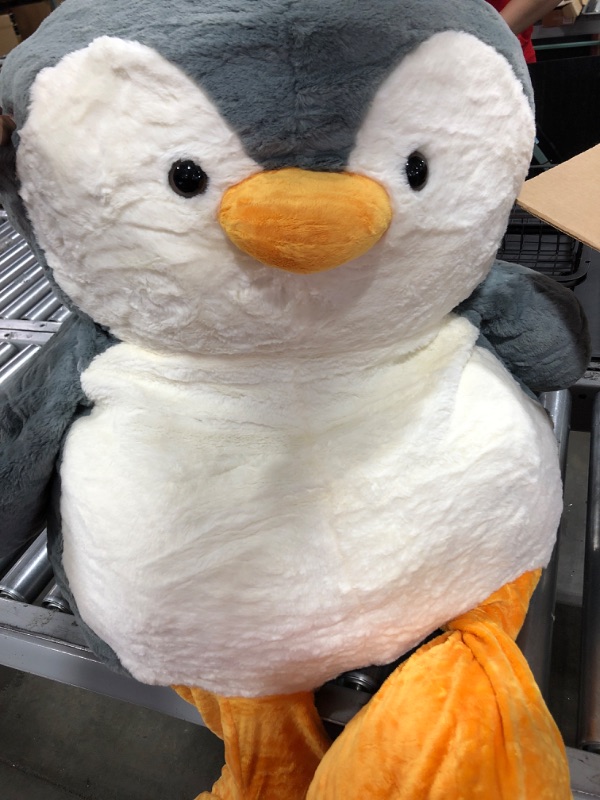 Photo 2 of Animal Adventure - Sqoosh2Poof - Jumbo Plush Character Compressed Inside Small Box - 54" Penguin
