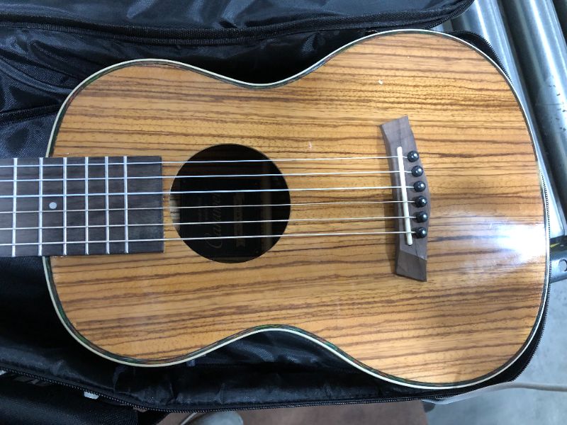 Photo 1 of Caramel 6 String CB103G 30 Inch High Gloss Zebra Wood Acoustic & Electric Ukulele Guitalele with Truss Rod with Padded Gig Bag, Strap and Wall hanger
