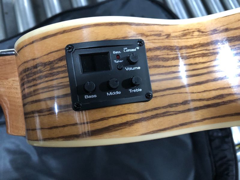 Photo 1 of Caramel 6 String CB103G 30 Inch High Gloss Zebra Wood Acoustic & Electric Ukulele Guitalele with Truss Rod with Padded Gig Bag, Strap and Wall hanger
