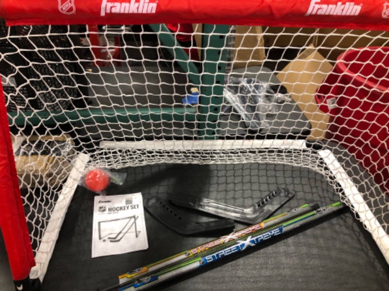 Photo 4 of Franklin Sports 36" NHL Hockey Goal with 2 Sticks - Youth Hockey Goal and Stick Set - Official NHL Product
