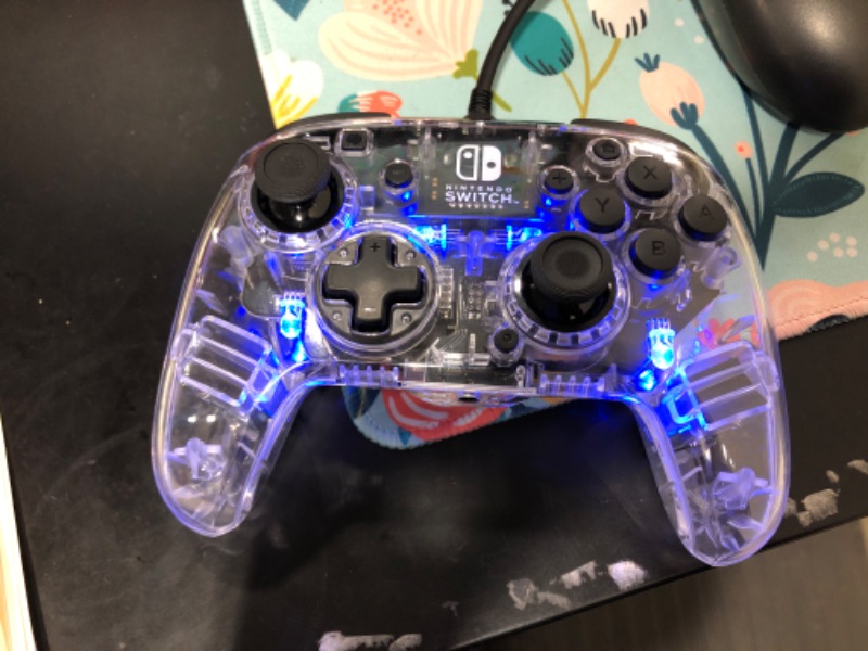 Photo 2 of Afterglow Deluxe+ LED Wired Gaming Controller - Licensed by Nintendo for Switch and OLED - RGB Hue Color Lights - See through Gamepad Controller - 3.5mm Jack - Dual Vibration - Paddle Buttons
