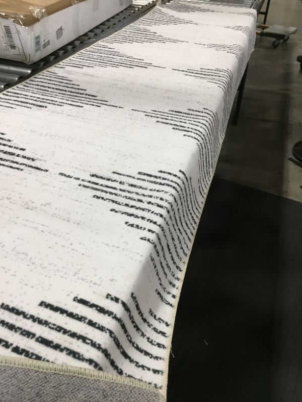 Photo 1 of 2'6" x 8'1" WHITE AND BLACK RUNNER AREA RUG