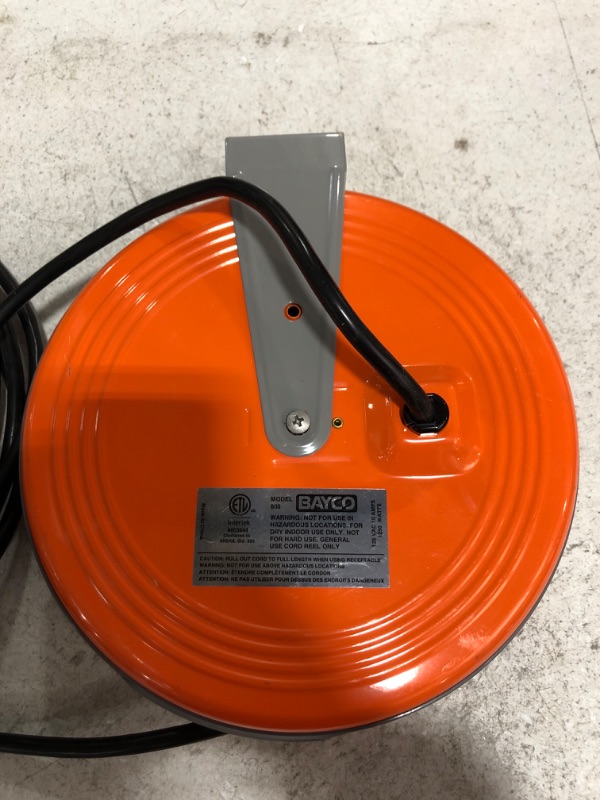 Photo 3 of Bayco SL-800 Retractable Metal Cord Reel with 3 Outlets - 30 Foot. MISSING BOX. PRIOR USE. PHOTO FOR REFERENCE. COLOR IS ORANGE.
