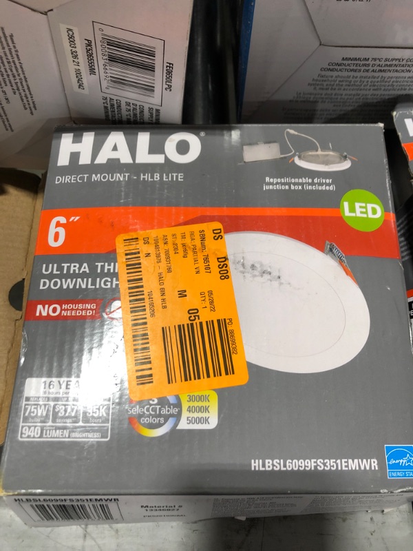 Photo 2 of ASSORTED HALO BRAND LIGHTING, ULTRA-THIN DOWNLIGHTS IN 6 INCH SIZE, TWIN HEAD FLOODLIGHTS, OUTDOOR SECURITY LIGHT. 10 ITEMS TOTAL. OPEN BOXES AND POSSIBLE USE ON SOME ITEMS. 