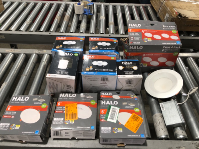 Photo 1 of ASSORTED HALO BRAND LIGHTING, ULTRA-THIN DOWNLIGHTS IN 6 INCH SIZE, TWIN HEAD FLOODLIGHTS, OUTDOOR SECURITY LIGHT. 10 ITEMS TOTAL. OPEN BOXES AND POSSIBLE USE ON SOME ITEMS. 