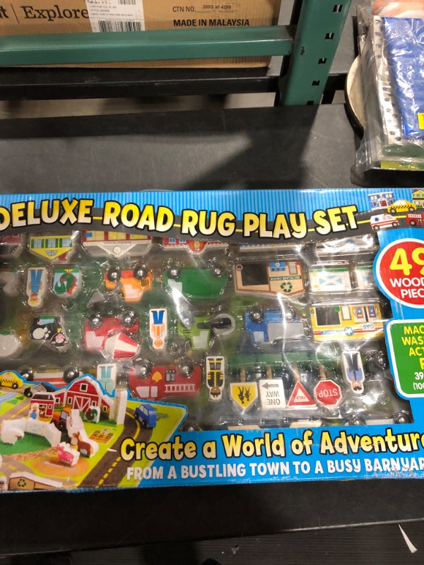 Photo 3 of Melissa & Doug Deluxe Activity Road Rug Play Set with 49pc Wooden Vehicles and Play
DAMAGED BOX