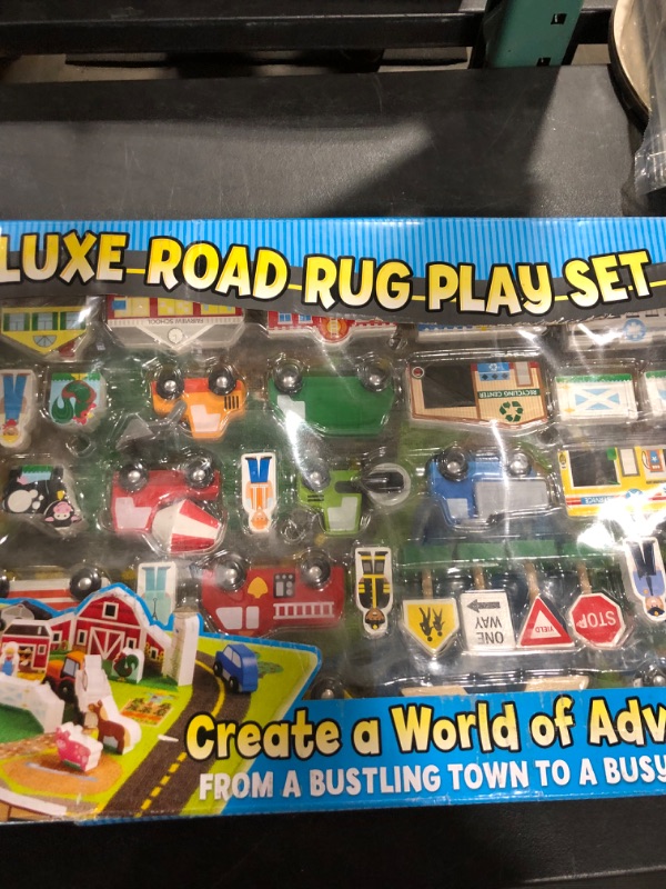 Photo 2 of Melissa & Doug Deluxe Activity Road Rug Play Set with 49pc Wooden Vehicles and Play
DAMAGED BOX