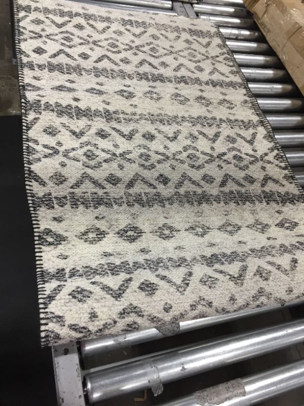 Photo 1 of 80" x 28" tribal patterned carpet 