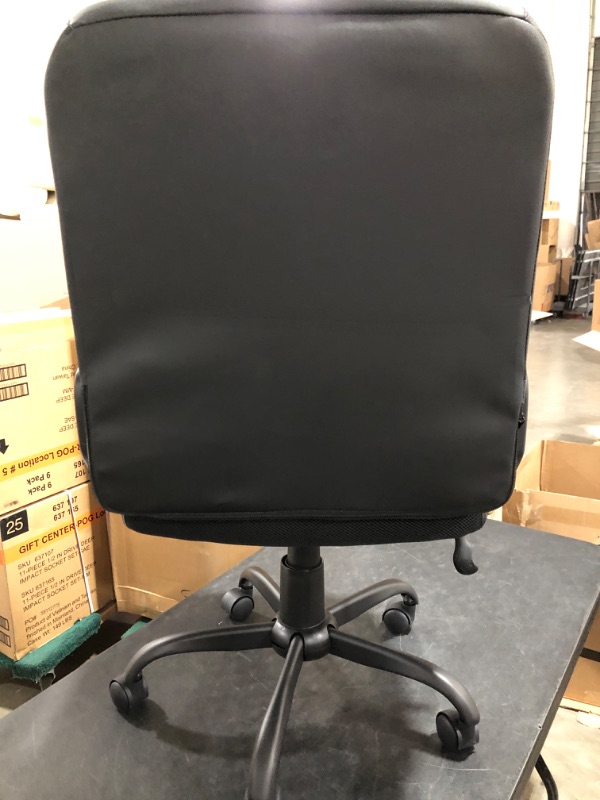 Photo 2 of FAUX LEATHER ROLLING OFFICE CHAIR. BLACK. PRIOR USE.