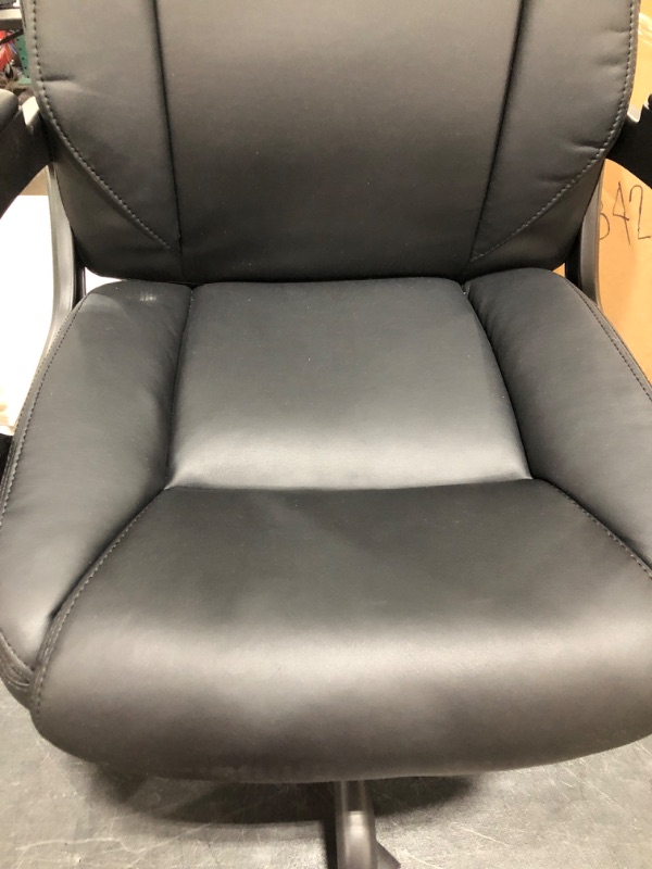 Photo 3 of FAUX LEATHER ROLLING OFFICE CHAIR. BLACK. PRIOR USE.