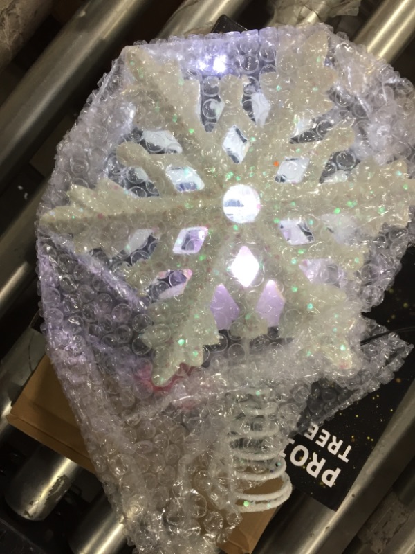 Photo 2 of Christmas Tree Topper with 3D Snowflake Projector Lights, 11.6" Snowflake Tree Topper Light Decorations, Indoor Outdoor Fantastic Rotating Projector Lights for New Year Holiday Christmas Tree (White)