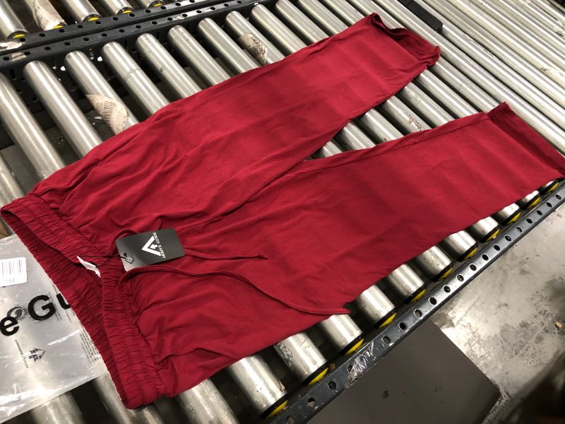 Photo 1 of ARRIVE GUIDE RED SWEATPANTS, SIZE L