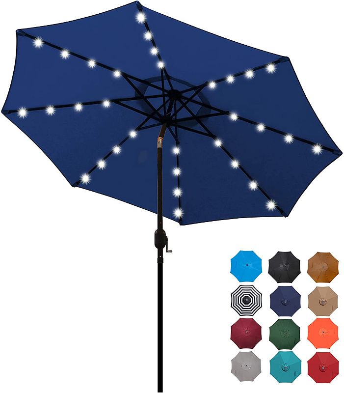 Photo 1 of Blissun 9 ft Solar Umbrella 32 LED Lighted Patio Umbrella Table Market Umbrella with Tilt and Crank Outdoor Umbrella for Garden, Deck, Backyard, Pool and Beach (Navy Blue)
