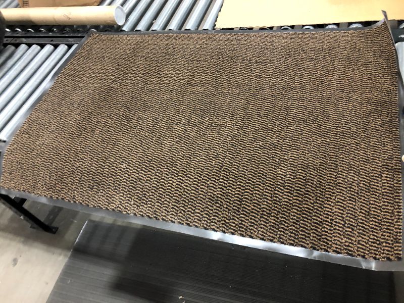 Photo 1 of 31x46 brown and black rug 