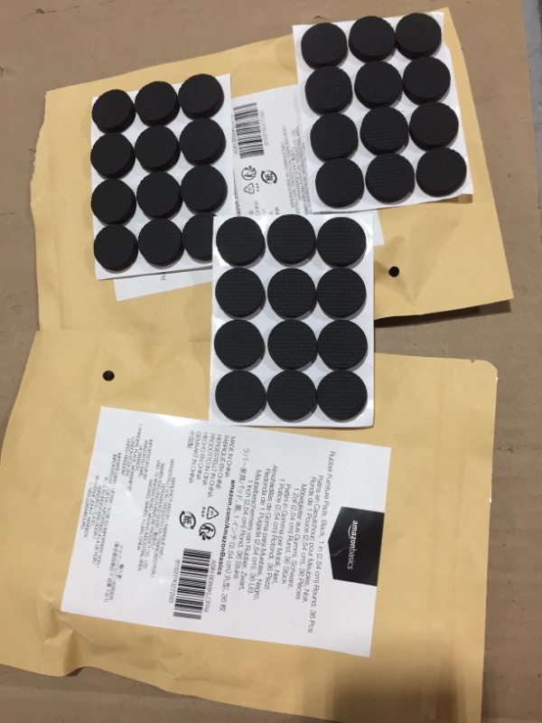 Photo 2 of 2 packs of Amazon Basics Rubber Furniture Pads, Black, 1'' Round, 36 pcs
